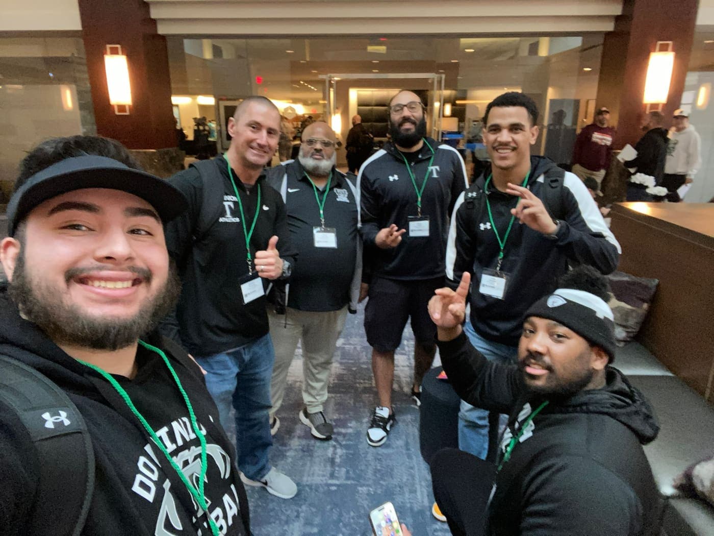 Coaches together at a Glazier Clinics event